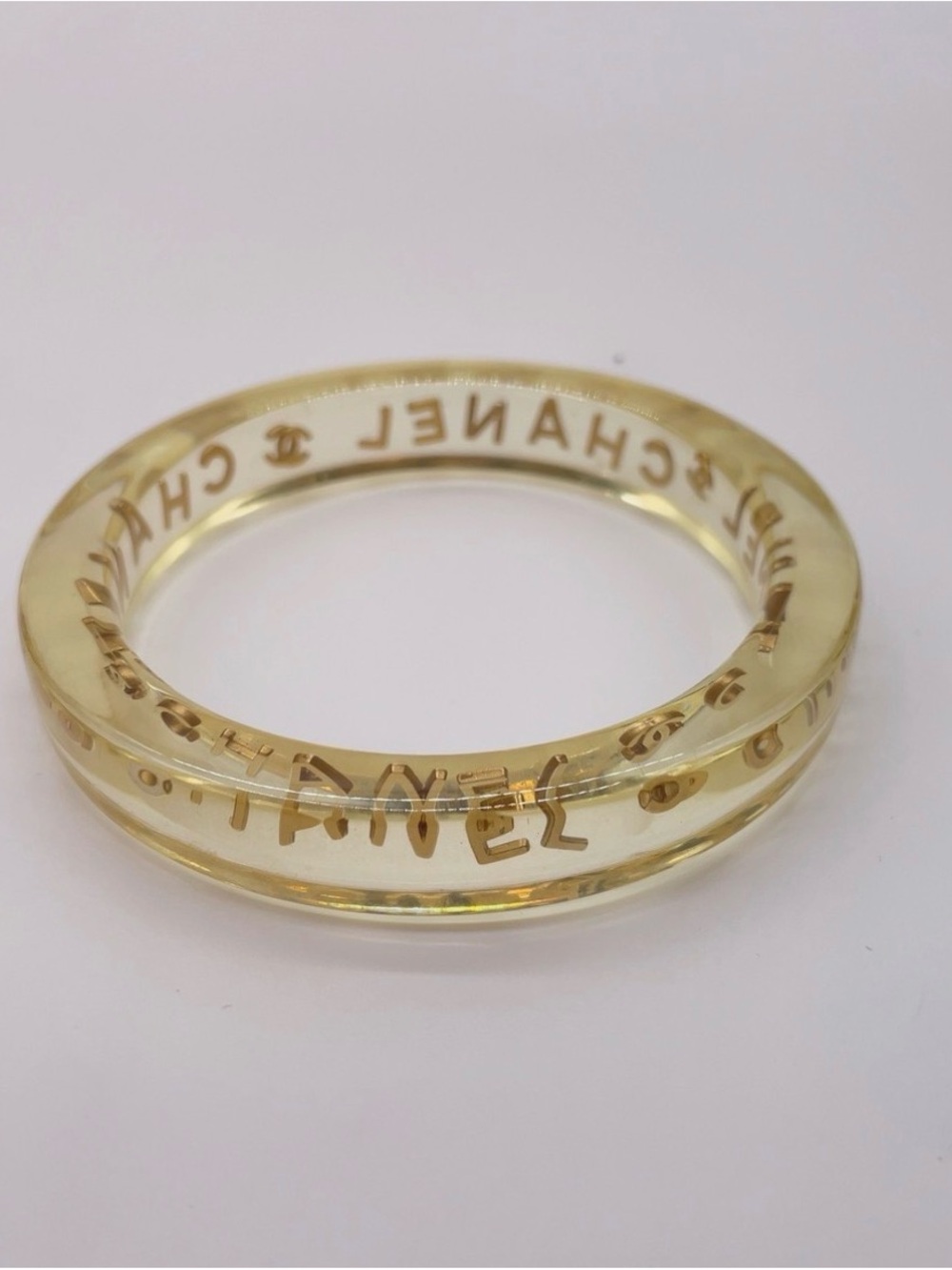 CHANEL LUCITE & Gold Letter Clear Acrylic Bangle - Picture 11 of 12